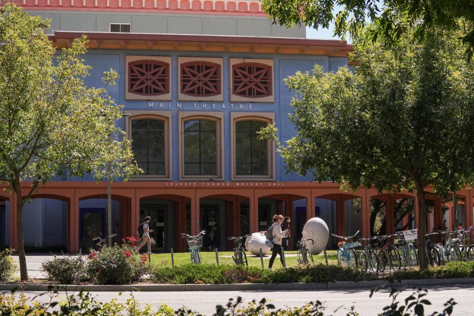 Student walking on UC Davis campus