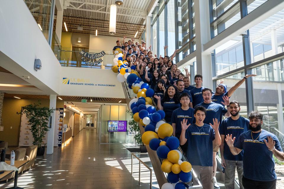 MPAc Class of 2026 standing on the staircase in the Gallagher Hall lobby